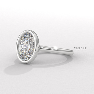 Oval moissanite ring with secure bezel detail