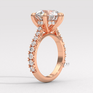 Round moissanite engagement ring on hand