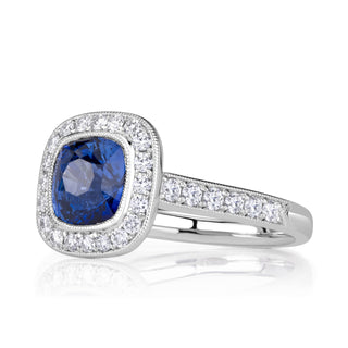 Blue cushion halo moissanite engagement ring side detail view