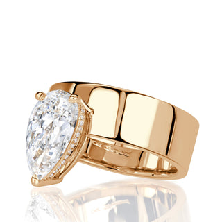 Pear moissanite cigar band engagement ring side detail view