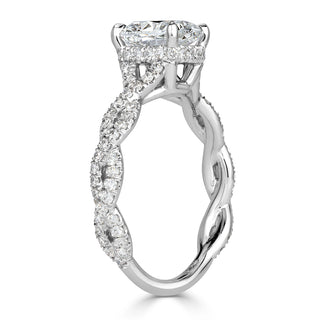Cushion moissanite infinity engagement ring on hand