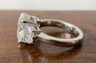 Round brilliant three stone moissanite engagement ring stone detail view