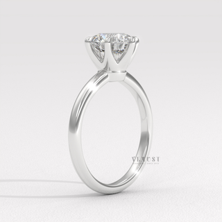 Round moissanite ring with clean setting detail