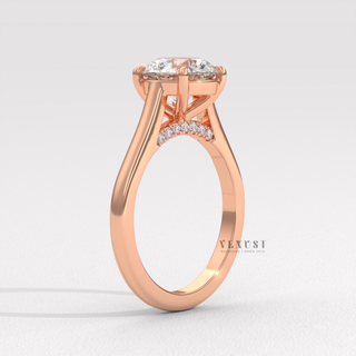 Low-angle view of a round cut moissanite engagement ring with a hidden halo and cathedral setting