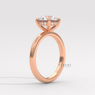 Tilted view of a round cut moissanite engagement ring in a solitaire setting showing its sparkle