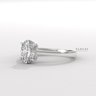 Oval cut ring with raised center stone