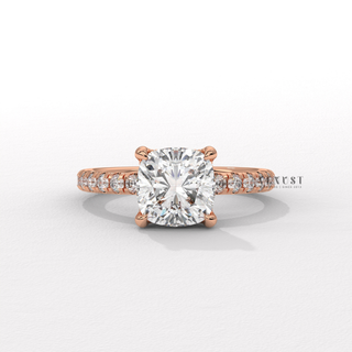 Centre-stone close-up of a cushion cut moissanite engagement ring with a pave band