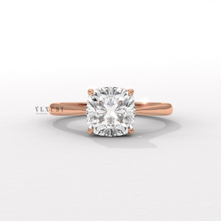Detailed setting shot of a cushion cut moissanite engagement ring with a hidden halo and cathedral setting