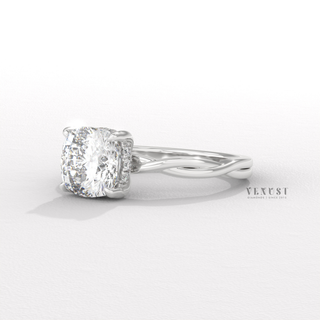 Profile shot of a cushion cut moissanite engagement ring on an infinity band and its band