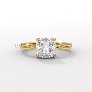 Hand model wearing a cushion cut moissanite engagement ring on an infinity band