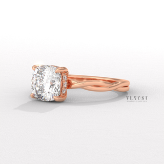 Lifestyle photo of a cushion cut moissanite engagement ring on an infinity band on the hand