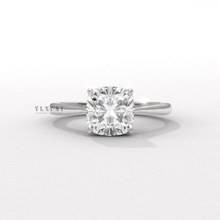 Hand model wearing a cushion cut moissanite engagement ring with a hidden halo and cathedral setting