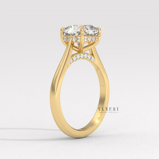 Lifestyle photo of a cushion cut moissanite engagement ring with a hidden halo and cathedral setting on the hand