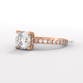 Profile shot of a cushion cut moissanite engagement ring with a pave band and its band