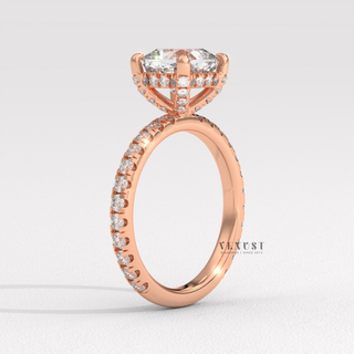 Three-quarter angle of a cushion cut moissanite engagement ring with a pave band