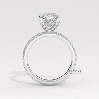 Side profile of a cushion cut moissanite engagement ring with a pave band