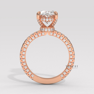 Front view of a oval cut moissanite engagement ring with a hidden halo and pave band under soft light