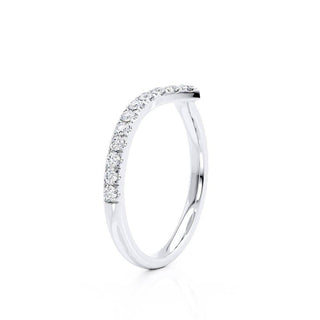 Delicate 0.21ct round moissanite wedding band shown on a finger