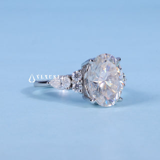 Graceful 2.0ct oval cluster moissanite ring angled view showing its sparkle