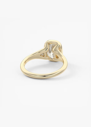 Elongated cushion three stone bezel engagement ring stone detail view