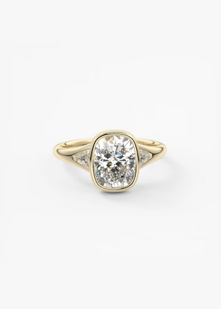 Elongated cushion three stone bezel engagement ring front view