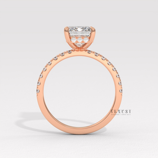 Overhead close-up of a emerald cut moissanite engagement ring with a hidden halo and pave band