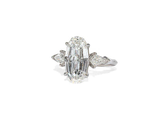 Oval step cut three stone moissanite engagement ring side view