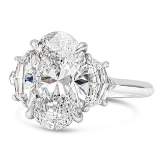 Elongated oval three stone moissanite engagement ring side view
