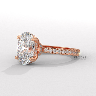 Full view of a oval cut moissanite engagement ring with a hidden halo and pave band with band detail