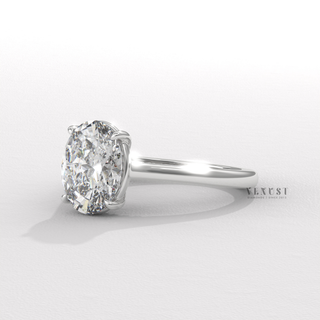 Front view of a oval cut moissanite engagement ring in a hidden halo solitaire setting from the left