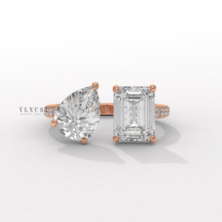 Pear cut moissanite engagement ring with emerald stone