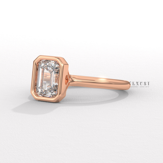 Emerald cut bezel engagement ring angled view