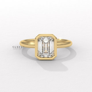 Emerald cut moissanite ring with bezel setting