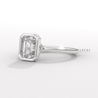 Emerald moissanite ring with sleek step cut sparkle