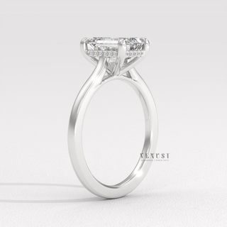 Emerald cathedral ring with step cut sparkle