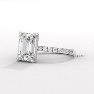 Lifestyle photo of a emerald cut moissanite engagement ring with a hidden halo and pave band on the hand
