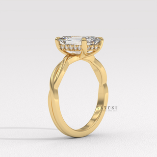 Front view of a emerald cut moissanite engagement ring on an infinity band