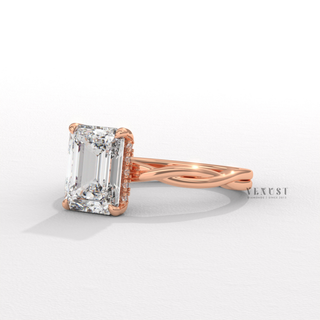 Profile shot of a emerald cut moissanite engagement ring on an infinity band and its band