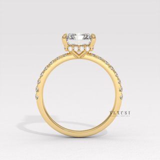 Front view of a radiant cut moissanite engagement ring with a pave band from the right