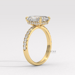 Radiant cut moissanite engagement ring with a pave band worn on a hand