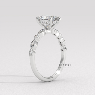 Oval cut moissanite ring with detailed pave work