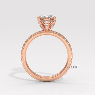Angled view of a marquise cut moissanite engagement ring with a hidden halo and pave band catching the light