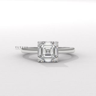 Asscher cut moissanite engagement ring with a hidden halo and cathedral setting shown on a finger