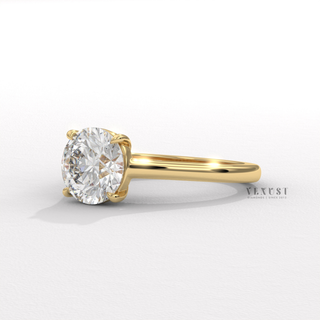 Detailed setting shot of a round cut moissanite engagement ring with a hidden halo and cathedral setting