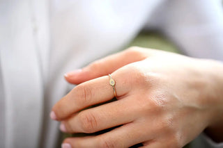 Chic round moissanite wedding band close up of the setting