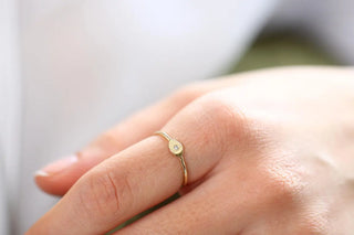 Chic round moissanite wedding band angled view showing its sparkle