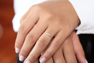 Stunning round cluster moissanite wedding band angled view showing its sparkle