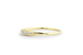Stunning round cluster moissanite wedding band shown on a finger