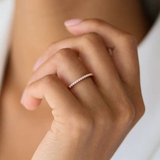 Refined round half eternity moissanite wedding band side profile view