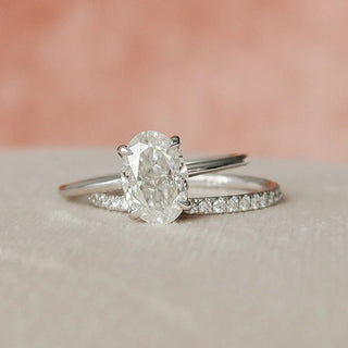 Timeless 1.5ct oval hidden halo moissanite wedding band angled view showing its sparkle